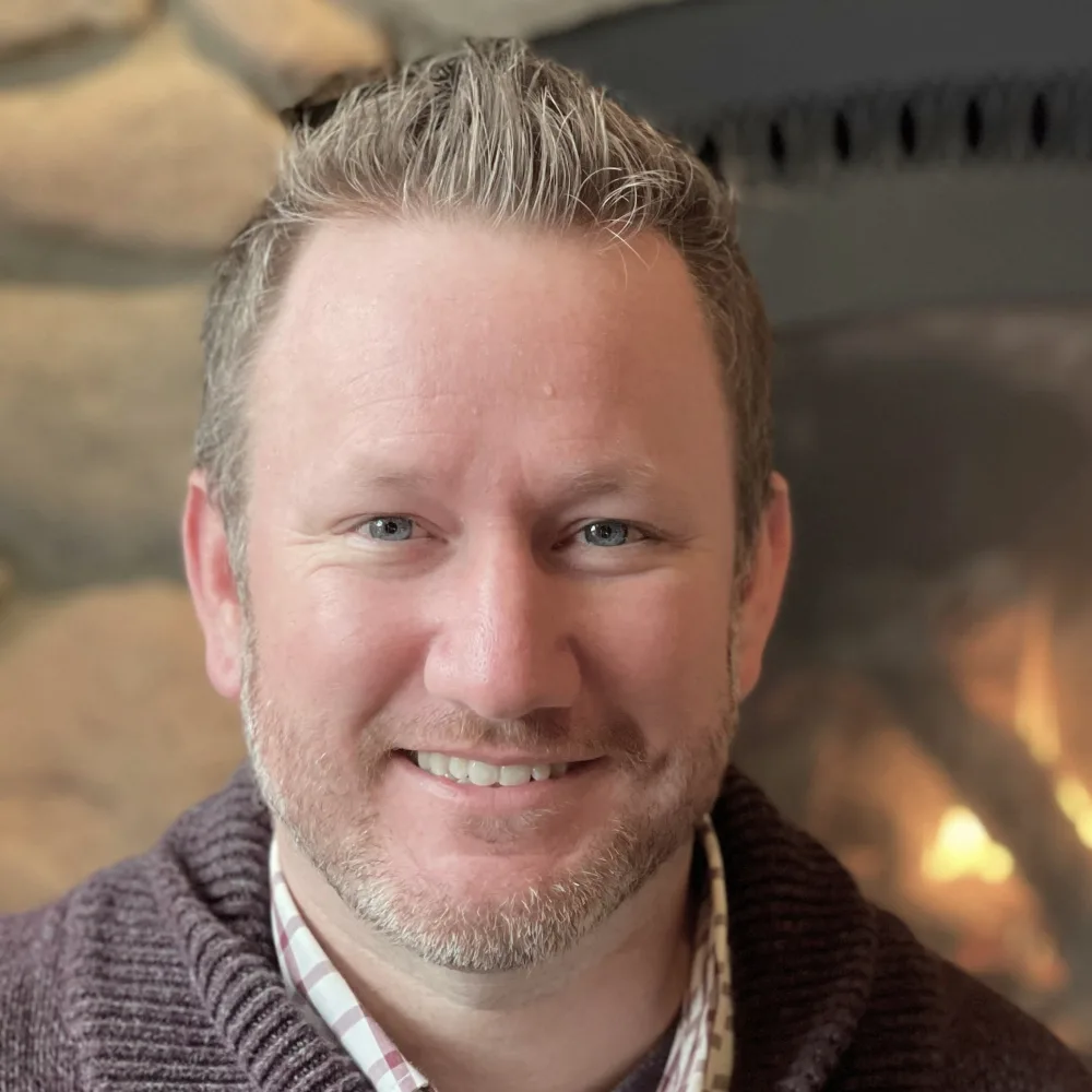 Alex Patterson — Warm Casual Fireside Headshot